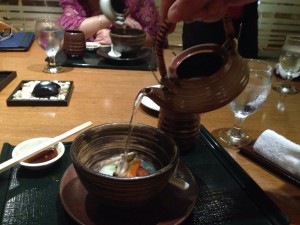 the broth being poured